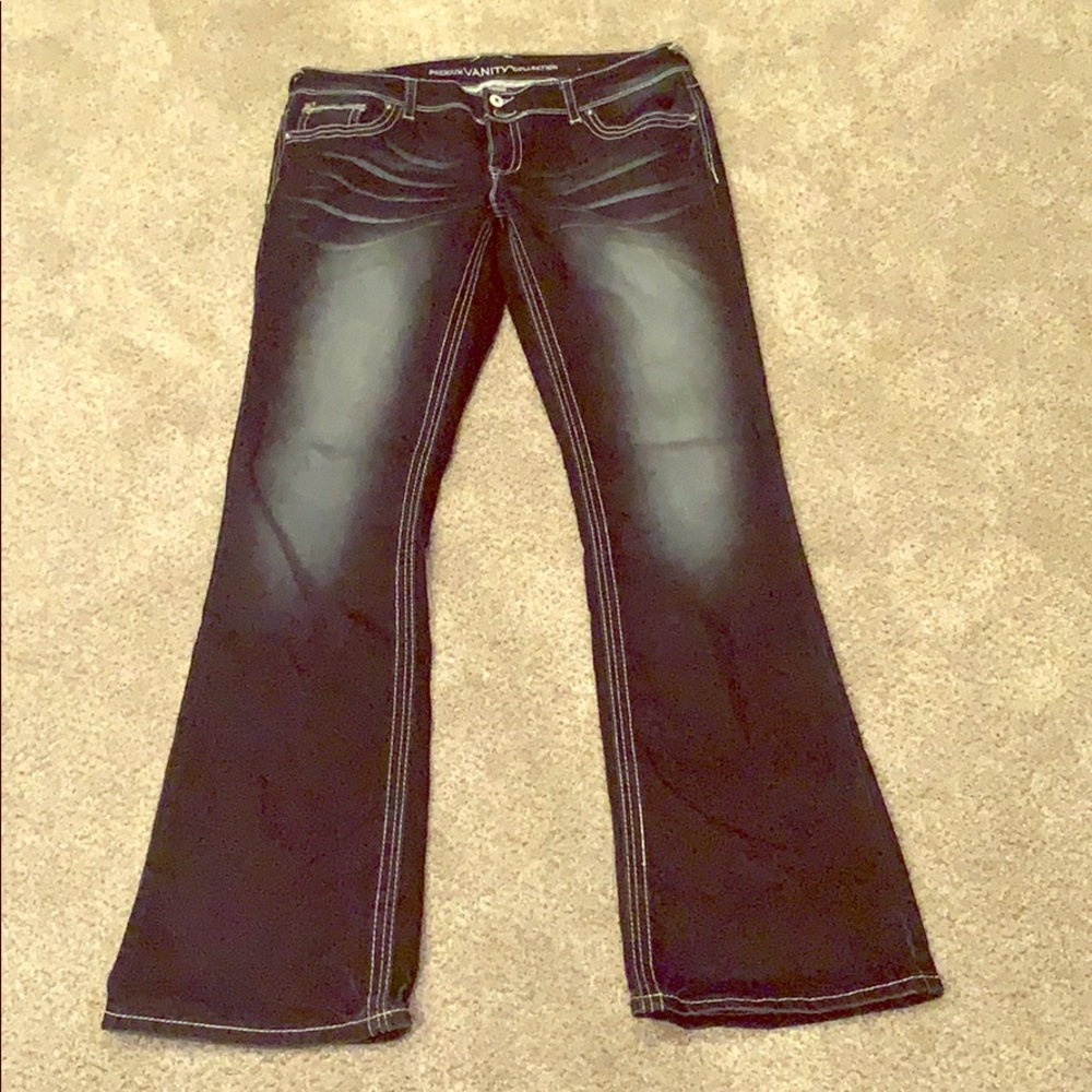 Boot cut street jean with back embellishment.